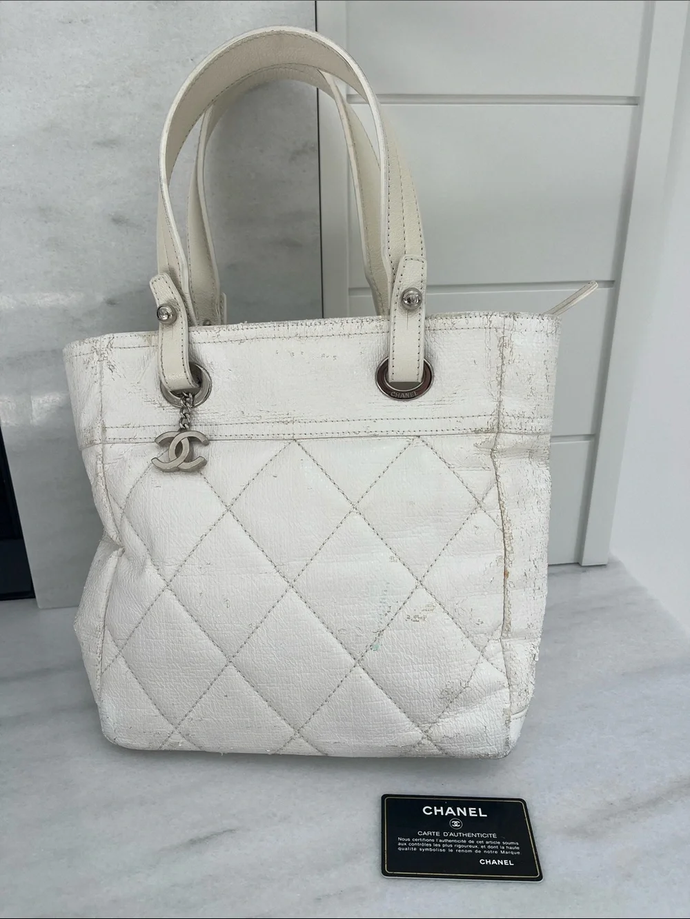 Chanel Paris Biarritz White Tote Bag Silver Charm Hardware Guaranteed Authentic